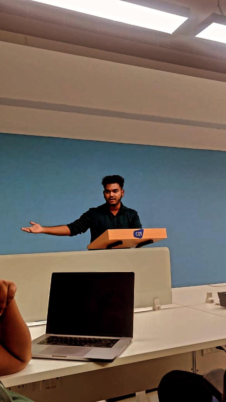 Jai presenting in front of a room